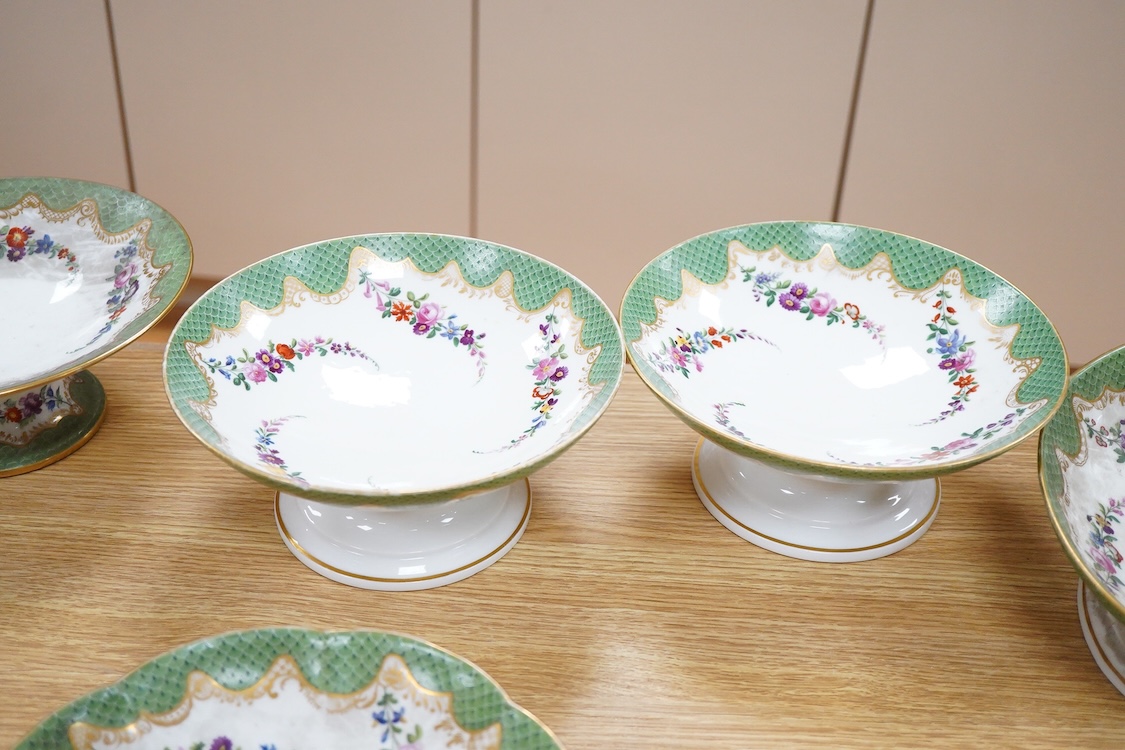A 19th century French Paris porcelain part dessert service with green scale borders by Nast Paris, largest 26cm wide